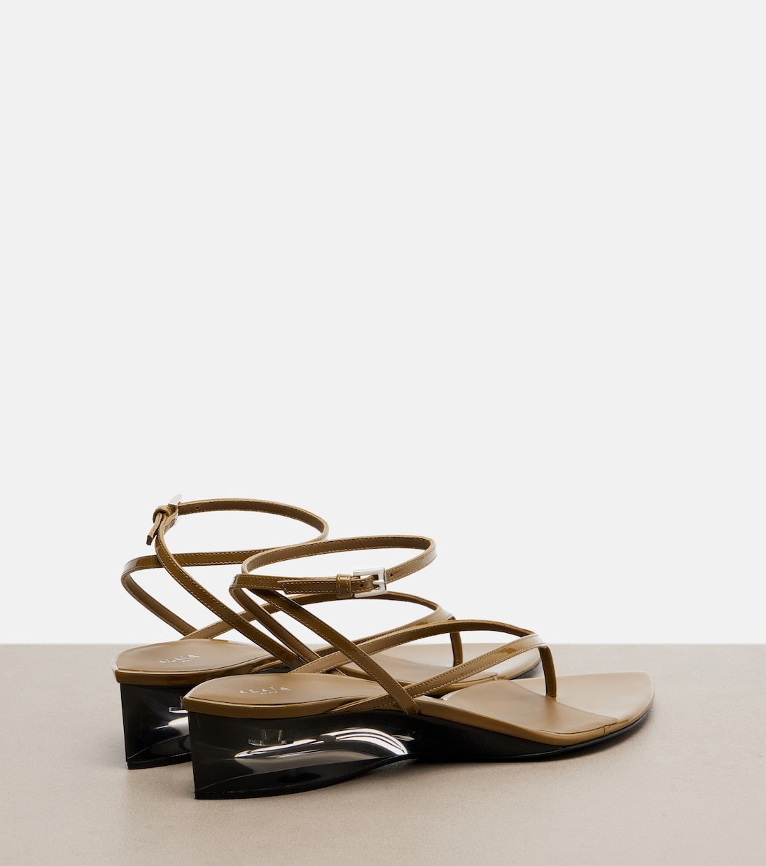 Alaia Invisible Patent Leather Wedge Thong Sandals