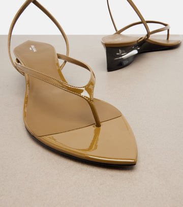 Alaia Invisible Patent Leather Wedge Thong Sandals